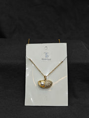 Seashell with pearl necklace