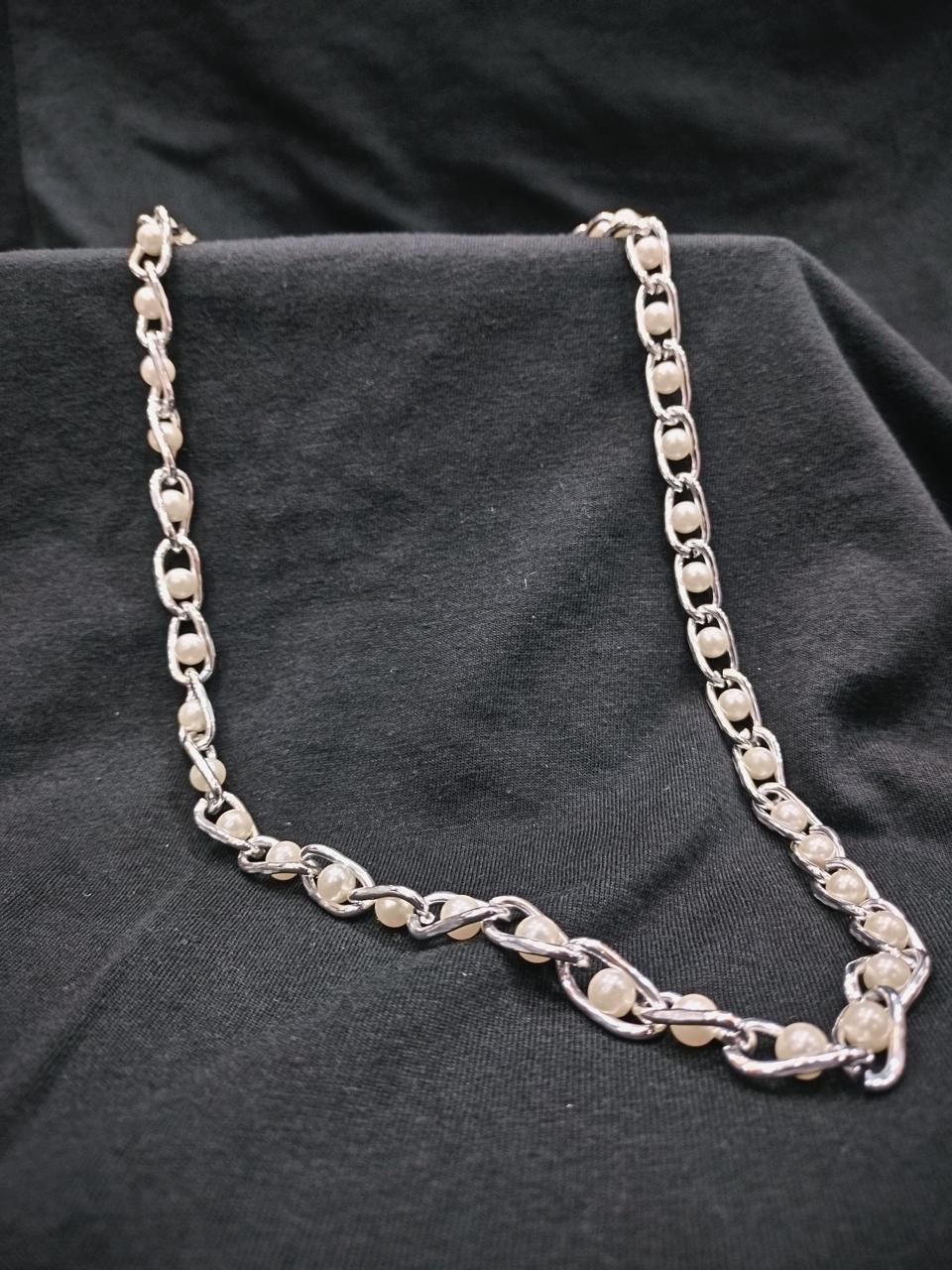 Elegance Entwined: A Fusion of Pearls and Silver