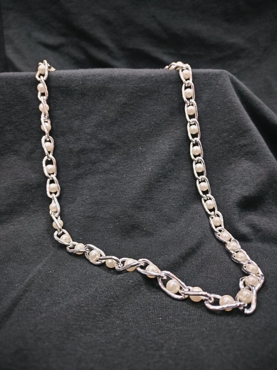 Elegance Entwined: A Fusion of Pearls and Silver